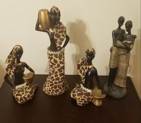 3 African women statues. Man & women African couple