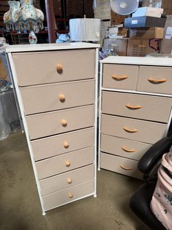 Fabric-Drawer Storage Unit – A tall bedroom cabinet featuring a wooden top, beige fabric drawers with wooden handles, and a white metal frame.