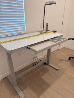 Tresanti adjustable height glass top desk