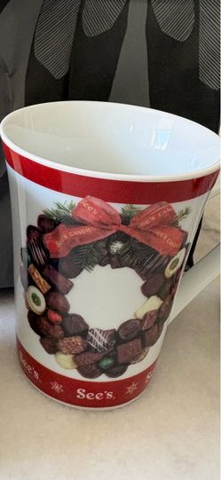 See’s coffee cup