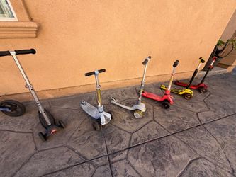 6 kids scooters $15 each and 1 valance bike $15