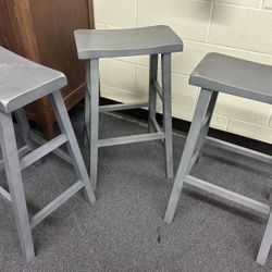 Set of three wooden bar stools