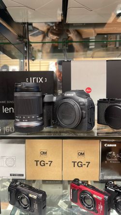 Canon R7 with 18-150mm.  Open box never been used