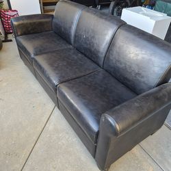 Modern black faux leather sofa