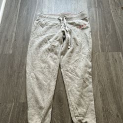 Grey sweatpants with pink accents
