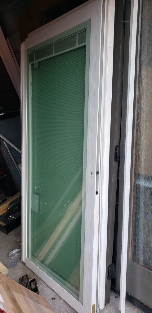 Nearly brand new patio sliders with mini-blinds