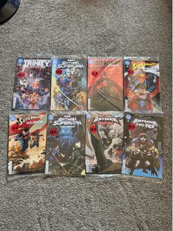 Comic books of Batman Wonder Woman and Superman