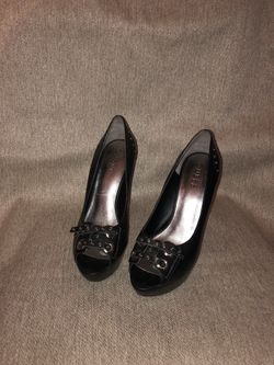 Guess, 4 1/2 inch high, size 6.5