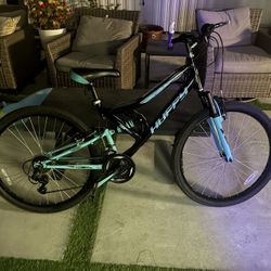 Blue Huffy Mountain Bike. willing to trade/negociate