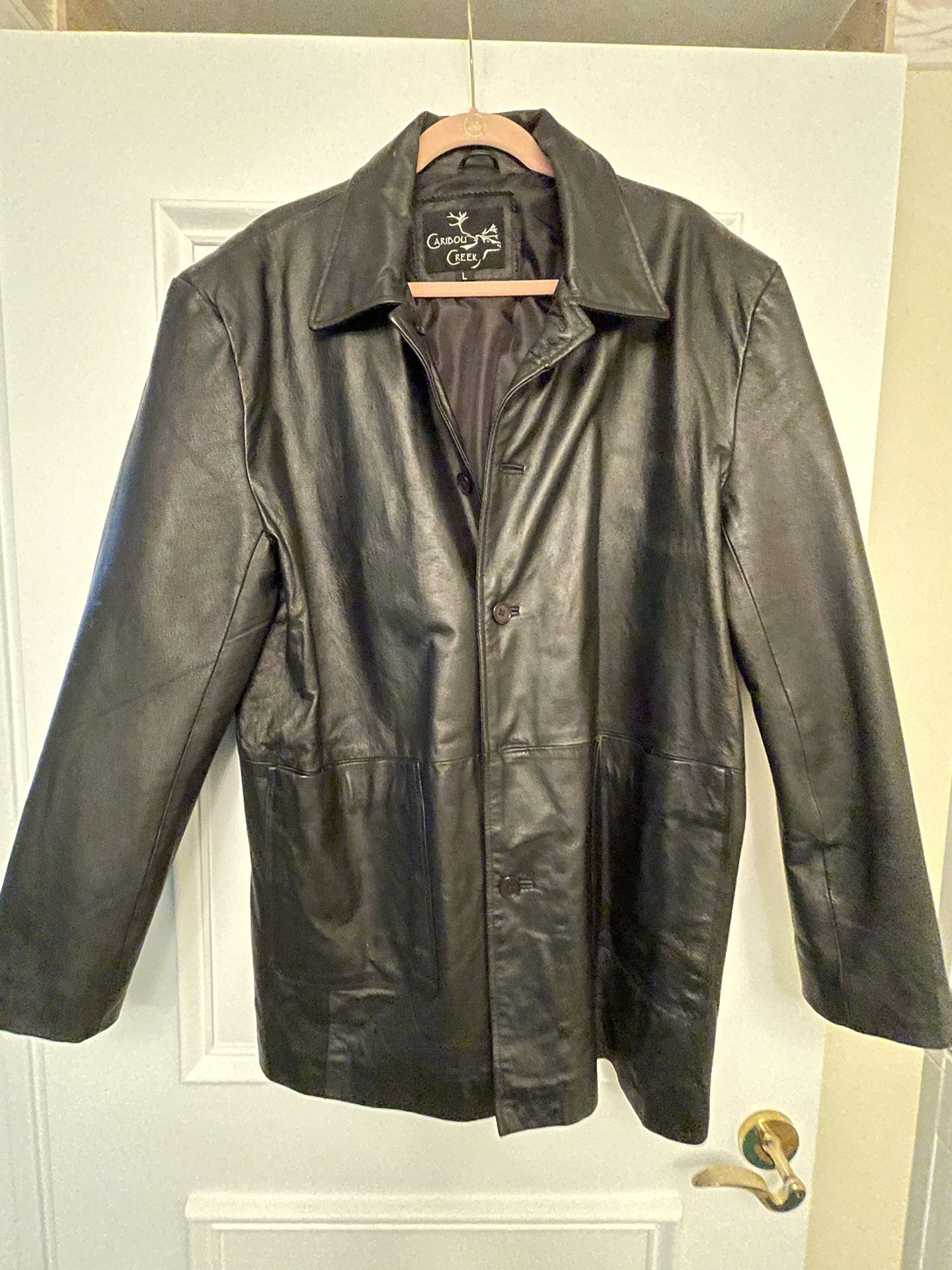 Black Leather Jacket Caribou Creek Size Large, Unisex  , Comes Down to The Area Below The Waist ,