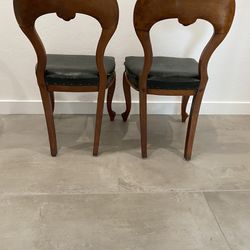 Antique chairs, leather cushions
