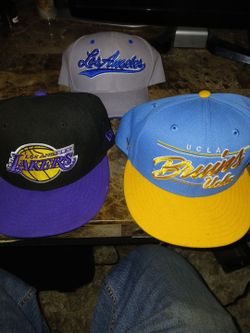 Three snapback hats