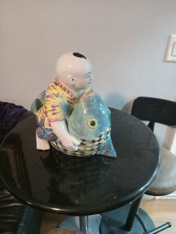 Japanese mid-century porcelain statue Asian décor man riding fish.