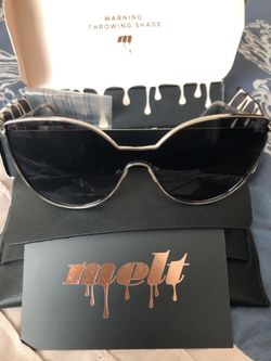 Really cool silver and black “Melt” sunglasses