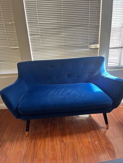 Blue velvet sofa