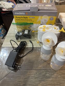 Madela Pump, Also Comes With A Portable Charger 