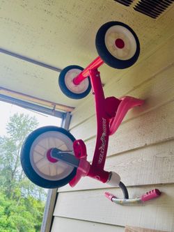 Radio Flyer Triple Play Trike, featuring a pink steel frame and versatile 3-in-1 design for toddlers.