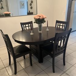 Dinning Table And Chairs. Like New With Storage Under For Wine 