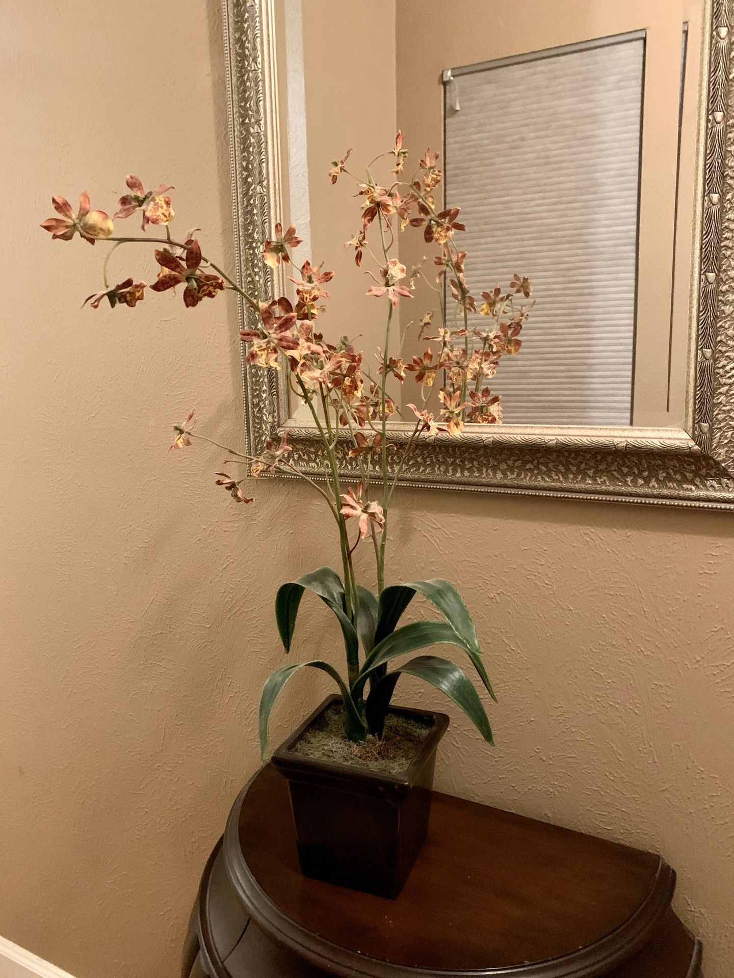 Fake red sunset orchid plant with pot