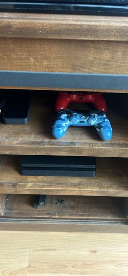 PS4 slim with two DualShock controllers