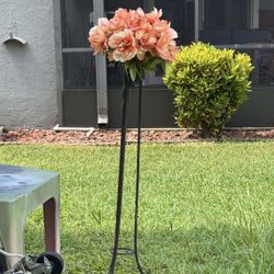 Iron pedestal with fake flowers you can put your own fresh flowers in there or your own fake Flowers Great For Wedding Funeral Cemetery Garden