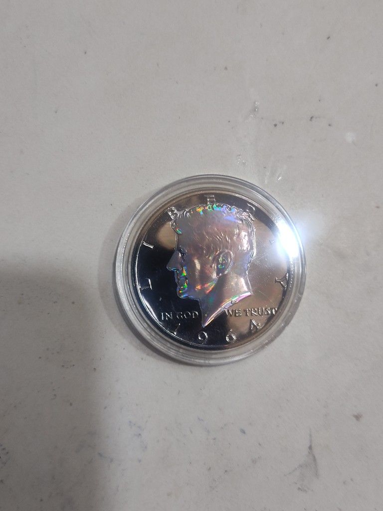 1964 Kennedy 90% Silver Layered In Black Ruthium. Kennedy 's Portrait And Eagle On Reverse Are Hologram Rainbow Colors.