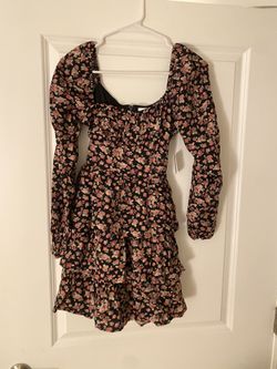 Black floral mini dress with pink accents, featuring a sweetheart neckline and flowy sleeves Size XS