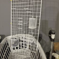 Organization wall with clips and containers to hang on it