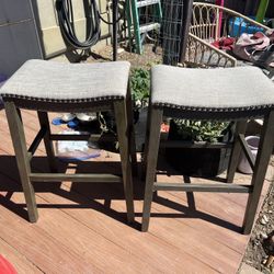 Saddle Counter Stool Set (2) in Grey Finish with Grey Fabric Bar Stool