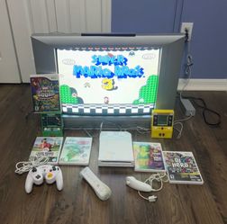 Wii with 4 downloaded games with controllers and everything else as shown TV not included.. tv not included…..
