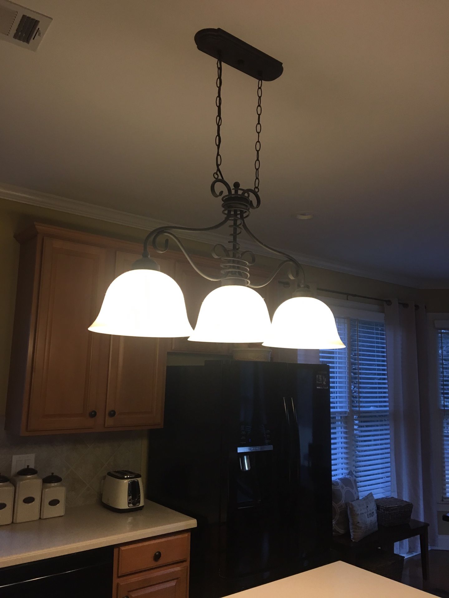 Island light with matching kitchen/dining light. Bronze.