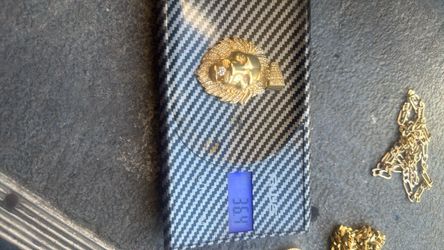 Lion pendant 14 K diamonds in mouth eyes and surrounding his facial hair