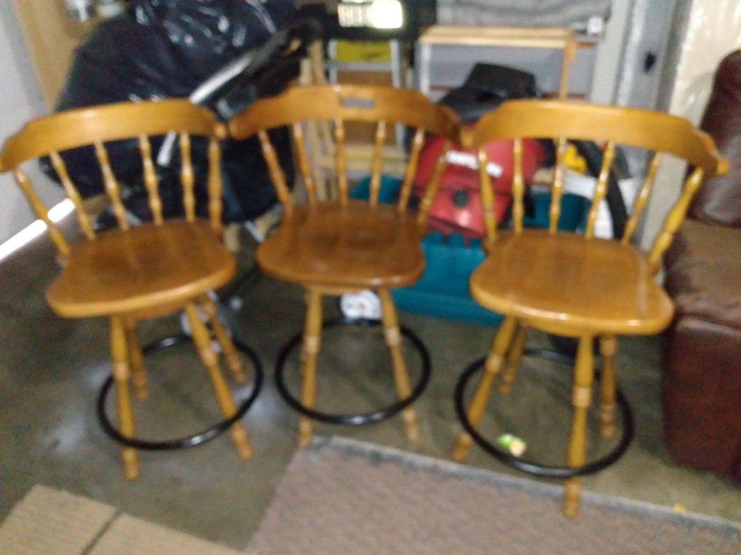 Three swivel chairs. 25"H