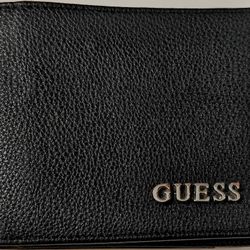 timeless faux-leather bifold wallet featuring a metal logo emblem at front.