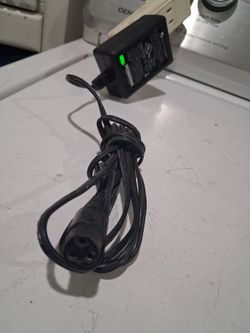 RAZOR charger QUILI POWER 
Class 2  battery charger. 
MODEL:  QL-  09002B-B H.

INPUT - AC 100 -120V  50/60 Hz.  1.0A.

OUTPUT:  24 V= 600 mA.