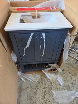 New Home Decorators Collection
Tupelo 24 in. Single Sink Freestanding Midnight Blue Bath Vanity with White Engineered Stone Top. Retails $320 with Tax