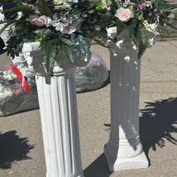 Roman bases with floral arrangements