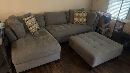 2 piece Grey sectional with ottoman