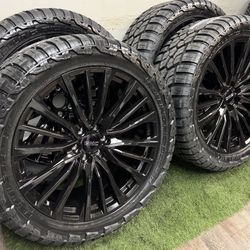 NEW 24 inch gloss black gm style wheels wrapped in 35x13.50R24 RBP
