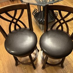 Two swivel bar stools.