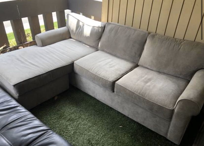 2 COUCHES - HAVE BEEN UNDER COVERING OUTDOOR