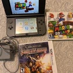 New Nintendo 3DS XL Metallic black with charger, and 2 games