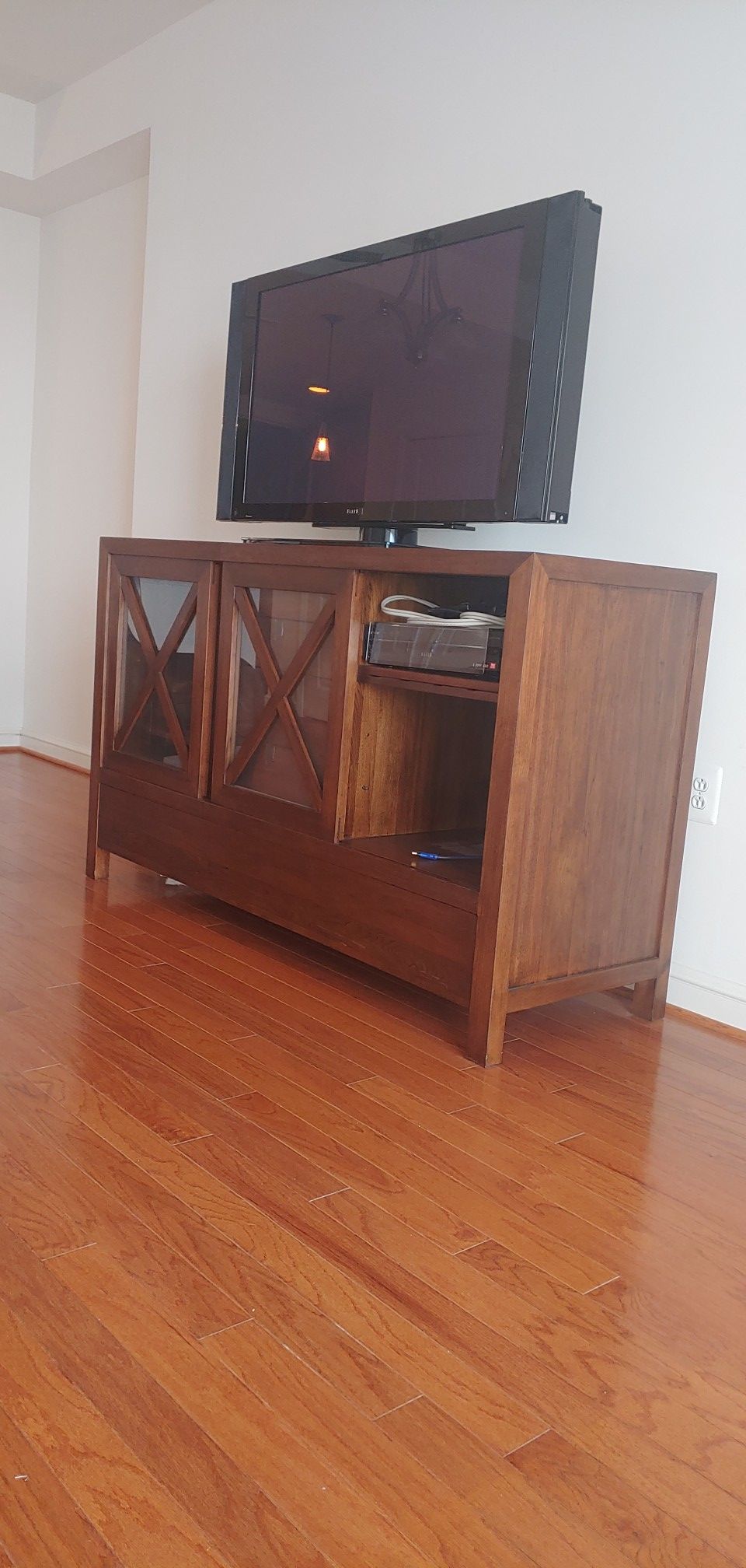 Price reduced!! Maria Yee, Inc. - Baxter walnut sideboard w/2 shelved side cabinets & 4 wood drwrs with leather pulls in center.