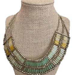 Elevate your jewelry collection with this stunning Chico's 3 Strand Statement Necklace. The gold-tone big oval beads are the perfect addition to your 