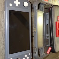 Nintendo Switch Lite W Games/Cases $$$