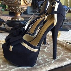 Woman’s Black And Gold Heels 