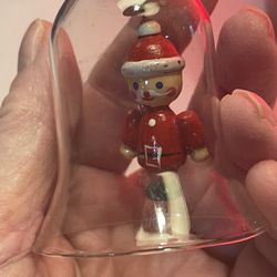Vtg Clear Glass Bell Ornament with Figurine Of Santa soldier. 2 1/2 Inch.