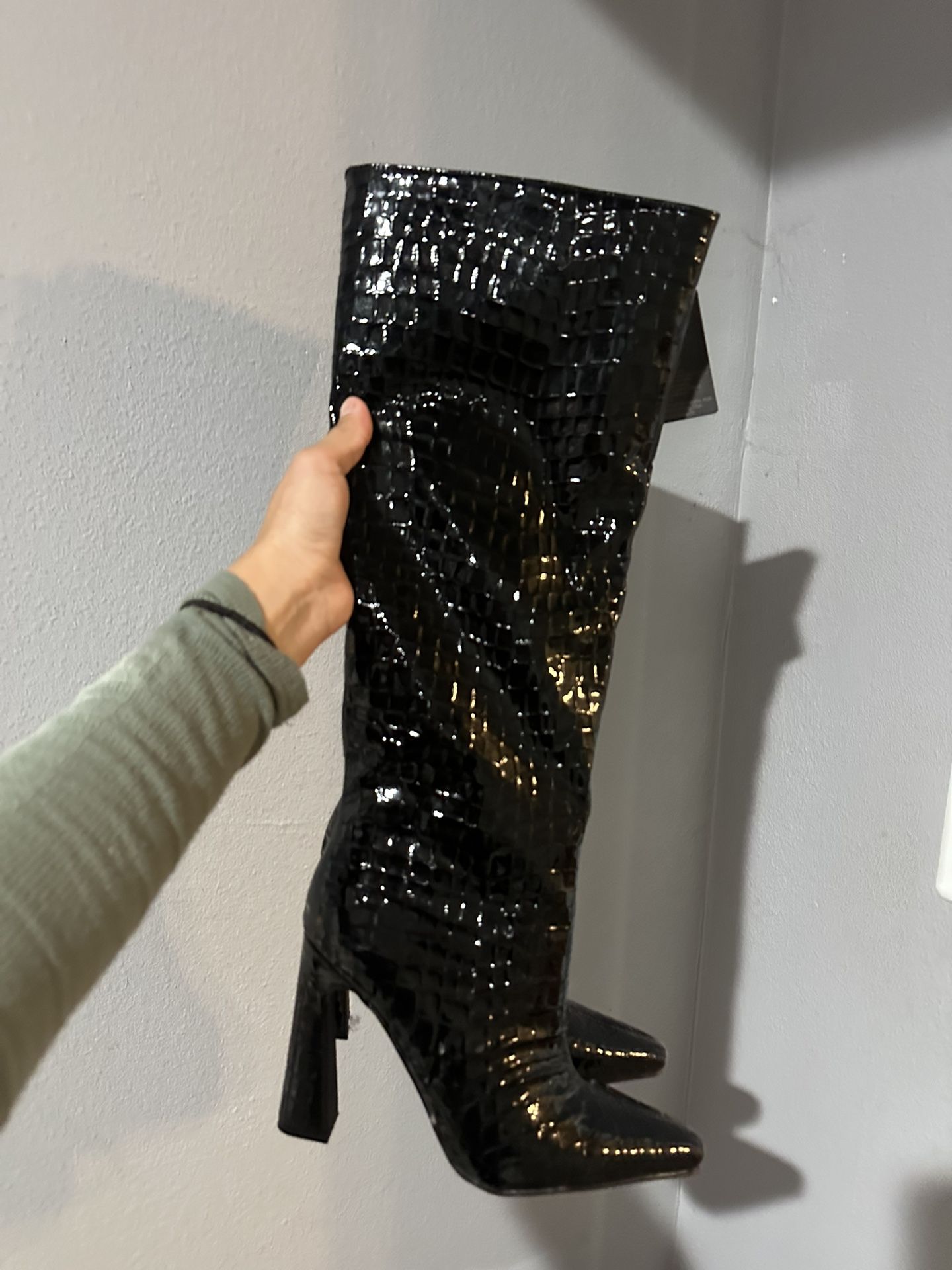 Black faux leather knee-high boots