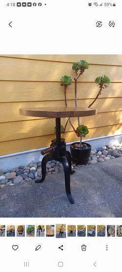 WORLD MARKET WOODEN TOP AND CAST IRON BASE WITH HAND CRANK