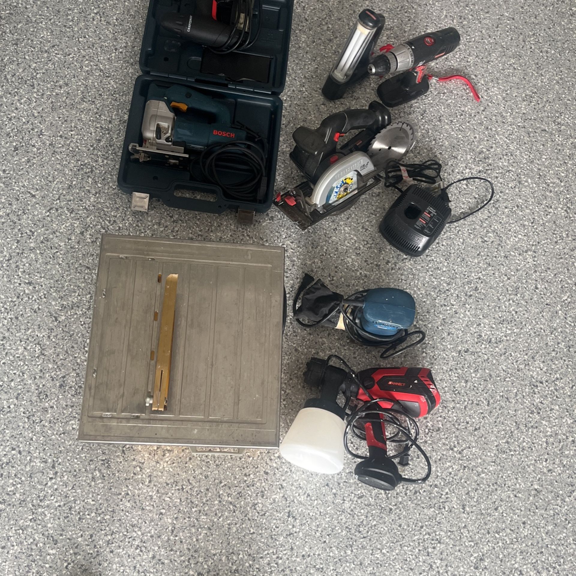 Tile Cutter Machine, Craftsman Saw. Drill, Lamp, Charger No Battery, Electric Paint Gun, Sander, Bosh Saw, Craftsman Nailing Gun 